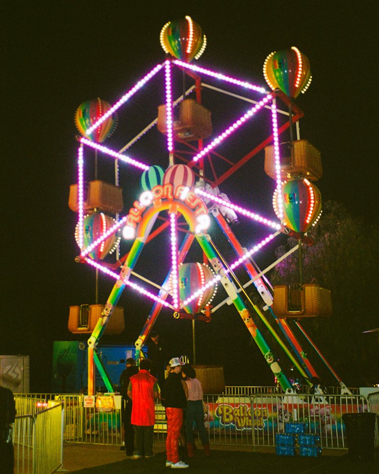 Lit carnival ride at night at SKVLKFest
